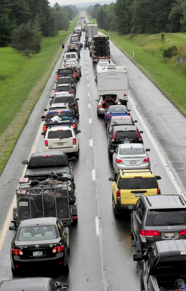 Southbound traffic on Interstate 95 was backed up for miles Sunday from mile 134 in Benton to the Clinton exit following a rollover involving a truck hauling a trailer. David Leaming/Morning Sentinel