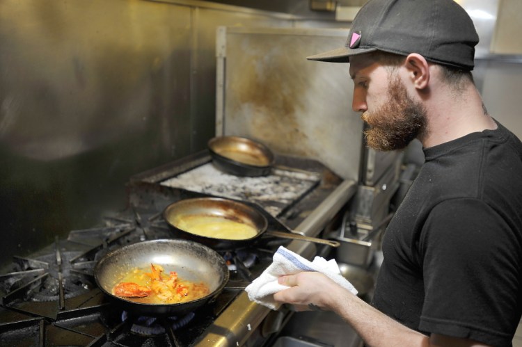 Jonathan Greydanus sautees lobster claws next to freshly made lobster bisque as he makes Lobster, Corn and Poblano Bisque at Zapoteca. Gordon Chibroski/Staff Photographer