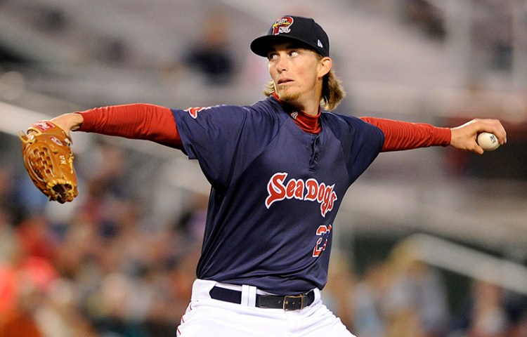 In this file photo, Portland Sea Dogs starting pitcher Henry Owens fires a pitch during the second game of a doubleheader vs. the Altoona Curve at Hadlock Field June 20, 2014. Gabe Souza/Staff Photographer