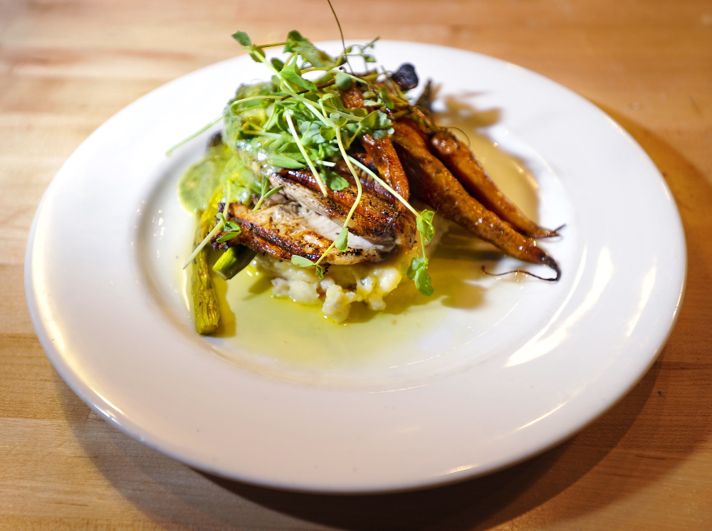 FREEPORT, ME - JULY 24: Food and atmosphere from Tuscan Grill in Freeport. This is the Chicken Under a Brick. (Gordon Chibroski/Staff Photographer)