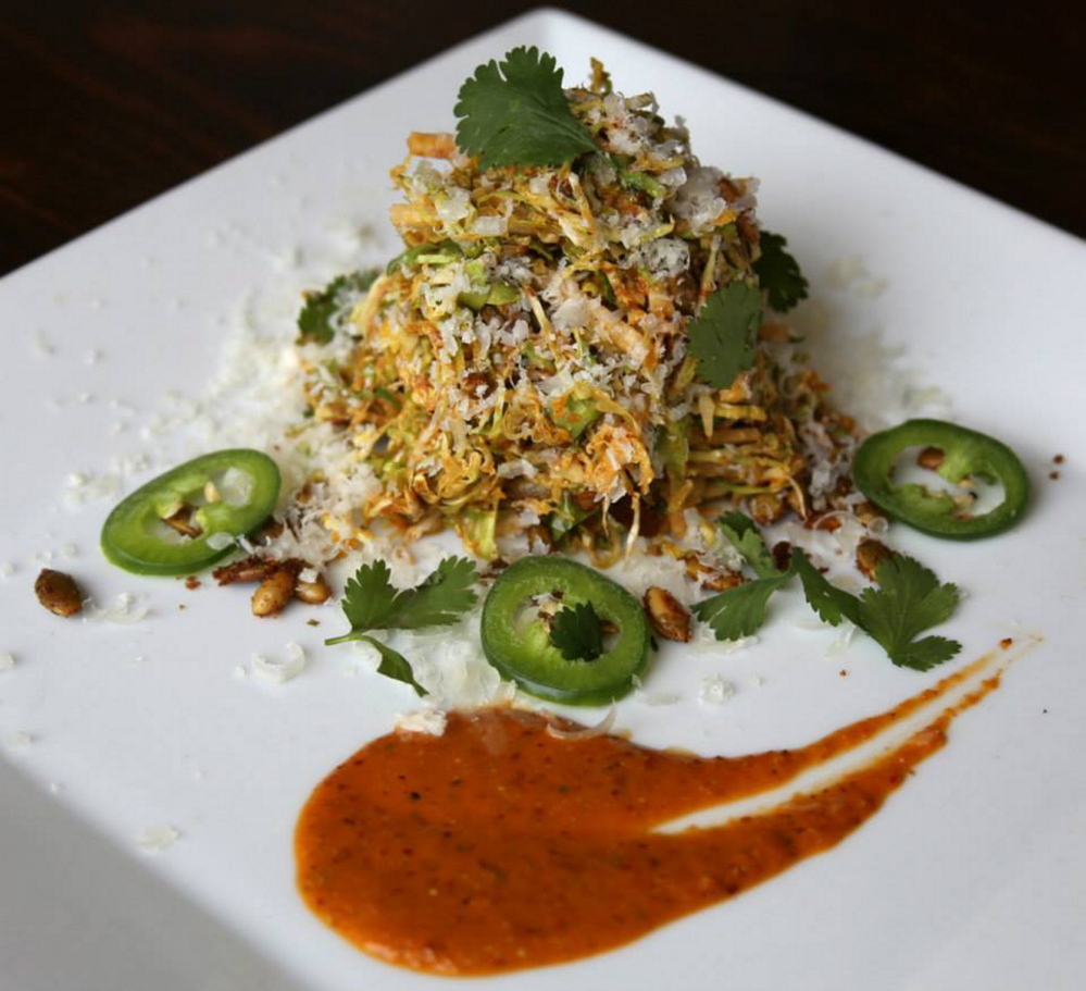 Ensalada con Coles de Bruselas, with shaved Brussels sprouts, cilantro, daikon radish, manchego and guajillo chili vinaigrette.
Photo by Reena Nemirovsky/Reenatype Photography