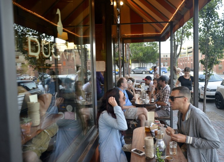 Andrea Greene and Adam Mitchell of Portland feast on fries at Duckfat.