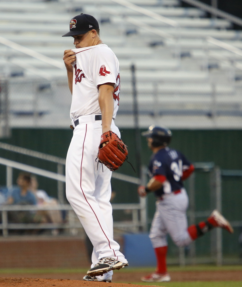 PORTLAND, ME - AUGUST 27: Sea Dogs starting pitcher Keith Couch reacts after giving up a home run to Jake Fox of Reading in the second inning Wednesday at Hadlock Field. Derek Davis/Staff Photographer