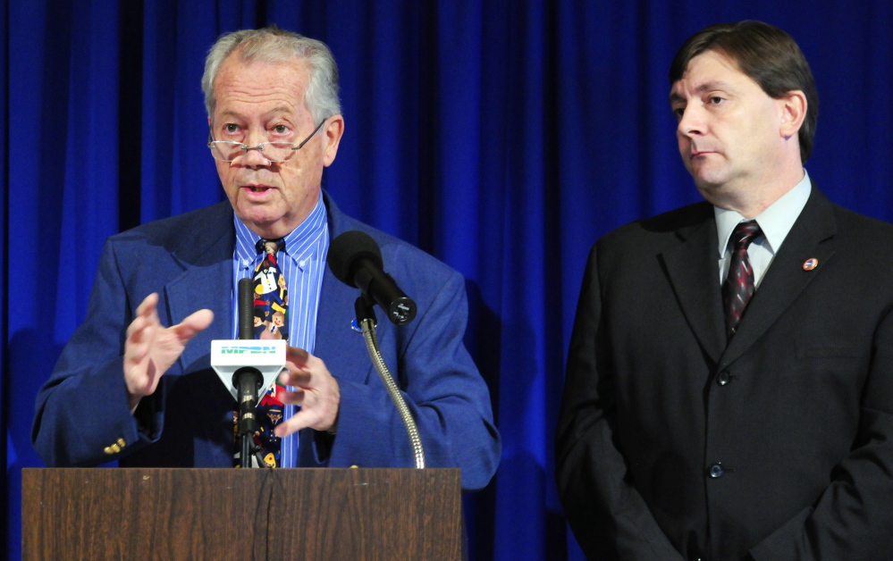 Rep. Richard Farnsworth, D-Portland, left, and Sen. Troy Jackson, D-Allagash, take part in a news conference Thursday just outside the governor’s office in the State House Hall of Flags.