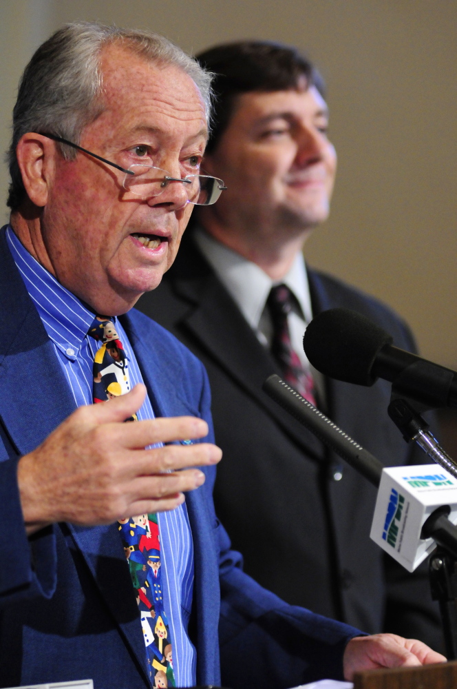 Rep. Richard Farnsworth, D-Portland, left, and Sen. Troy Jackson, D-Allagash, take part in a news conference Thursday just outside the governor’s office in the State House Hall of Flags.