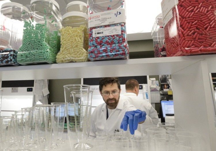 Compounding technician Travis Agaman works at Apothecary by Design’s facility at 141 Preble St. Its original retail pharmacy is located at 84 Marginal Way.