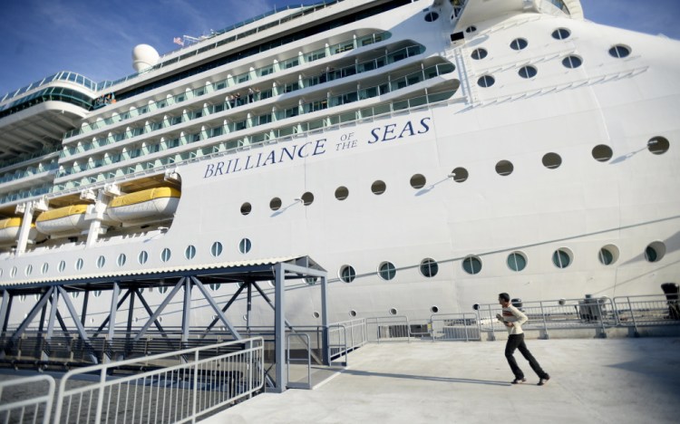 One of the final passengers to board makes his way toward the Brilliance of the Seas as the cruise ship prepares to depart for Halifax, Nova Scotia, after spending the day in Portland on Monday. Seven other ships are scheduled to visit the port this week.