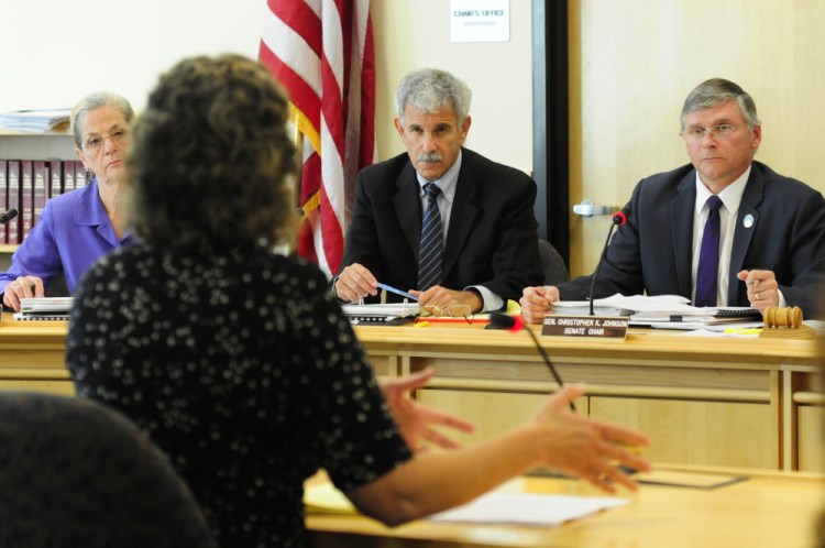 Sen. Margaret Craven, D-Lewiston, left, Sen. Roger Katz, R-Augusta, and Sen. Chris Johnson, D-Somerville, listen as Office of Program Evaluation & Government Accountability Director Beth Ashcroft speaks about the Riverview Psychiatric Center during a meeting of the Government Oversight Committee on Wednesday in the Cross State Office Building in Augusta.