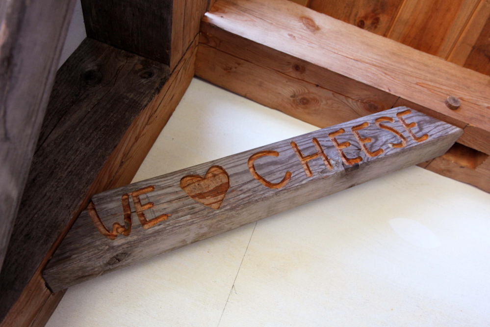 “We love cheese” is inscribed in a building at Kennebec Cheesery at Koons Farm in Sidney on Sunday during Maine Open Creamery Day.