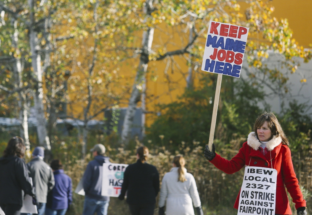 Ann Nora Murphy, who has worked for FairPoint for 28 years, pickets outside the company’s 5 Davis Farm Road location in Portland for a fourth day Monday.