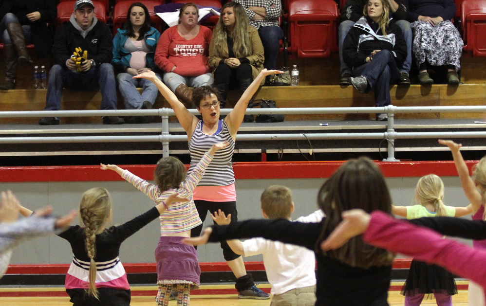 Farmington Postmaster Sue Jones leads a dance rehearsal Saturday at the Farmington Community Center. “Sue is so fun and crazy, and she’s just great with the kids,” said Angie Casavant, the mother of two dancers. This is the second year that Jones has directed a show in Farmington, set for Dec. 6 at the community center.