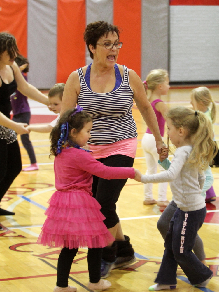 Farmington Postmaster Sue Jones leads a dance rehearsal Saturday at the Farmington Community Center.