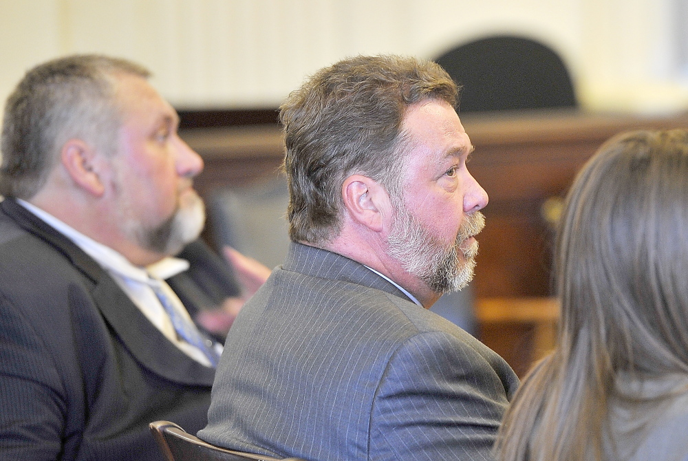 ALFRED, ME - NOVEMBER 21: Ronald Petersen, sitting between his counsel, looks to the jury as they begin to announce their guilty verdict at his trial for fraudulent billing in York County Superior Court - Alfred. (Photo by Gordon Chibroski/Staff Photographer)