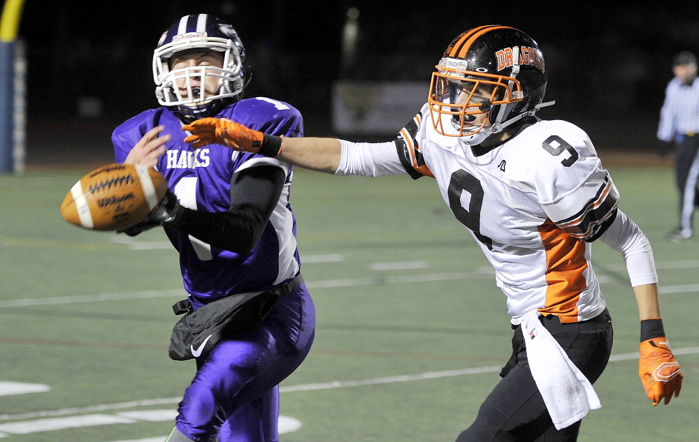 Marshwood’s Luc Blanchette couldn’t pull in this interception as Brunswick receiver Rick Klatt broke up the play, but Blanchette did just about everything else right Saturday, rushing for more than 200 yards while leading the Hawks to a 44-18 win in the Class B state championship game.