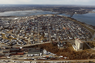 An aerial view of Munjoy Hill shows the development that has occurred in Portland in recent years. A spokeswoman for the Munjoy Hill Neighborhood Organization says the number of short-term rentals in the area being advertised on Airbnb is "quite astounding," as property owners realize they can make better money by renting their units to tourists, rather than residents.