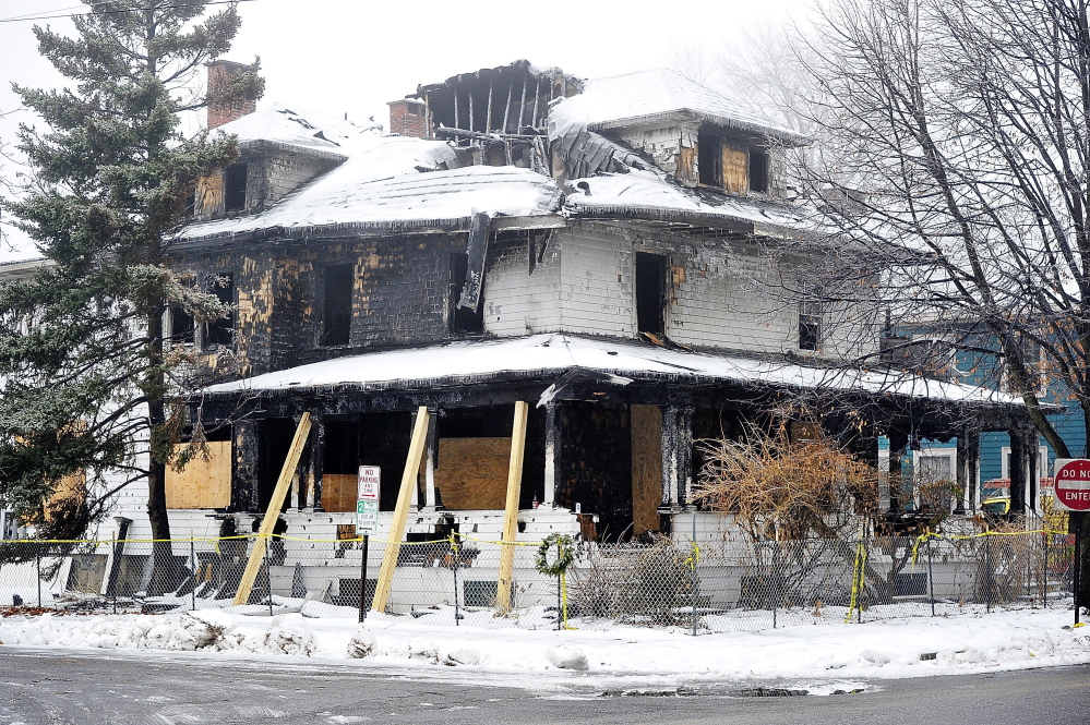 The building at 20-24 Noyes St. was returned to the landlord after city inspectors deemed it structurally safe. But with a large hole in the roof and no windows on the upper floors, the elements are starting to take a toll.