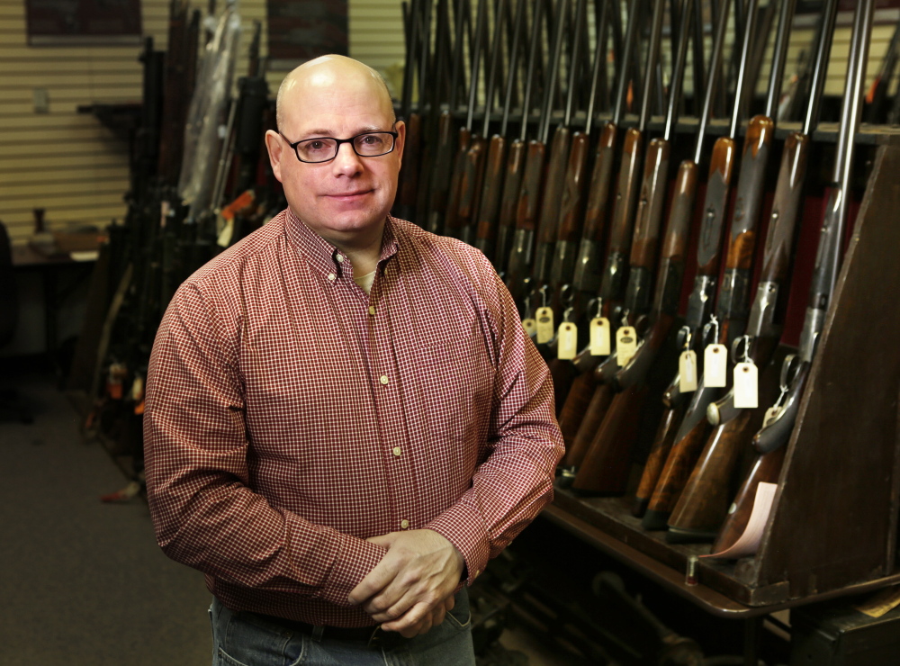 John Keene of Auburn works with rare firearms at James D. Julia auctioneers in Fairfield. He is proud of the work he and his 133rd comrades did in Iraq.