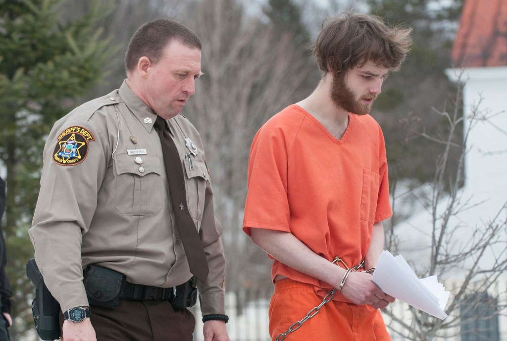 Dana Craney is escorted to a waiting jail transport by Franklin County Sheriff's Deputy Walter Fail after Carney's initial appearance in Franklin County Superior Court in Farmington on Monday. Craney was in court in connection with the death of his grandmother Joanne Goudreau of Weld.
