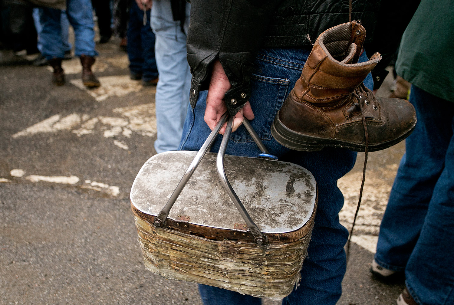 Scott Lally of Bucksport carries his lunch box and work boots out of the Verso Paper mill for the last time Wednesday.