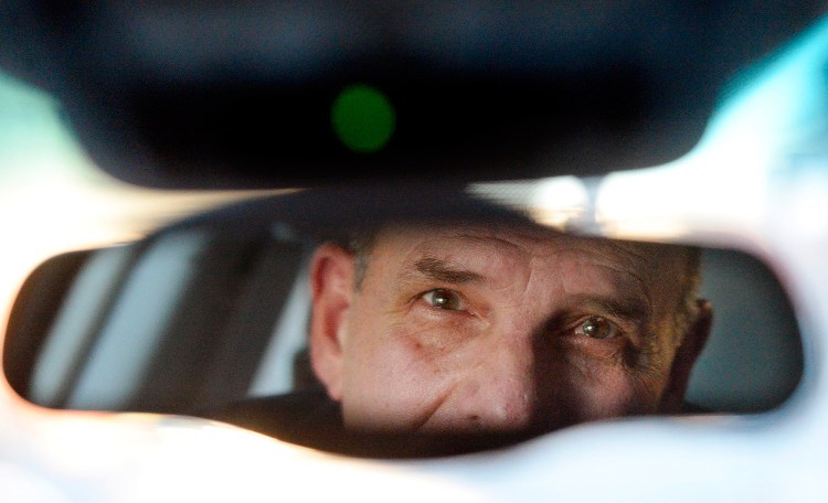 Paul McDonough operates his taxi in January 2015. His lawsuit accused the city of Portland of racial discrimination for denying him a permit to work as part of the Portland International Jetport's taxi pool.