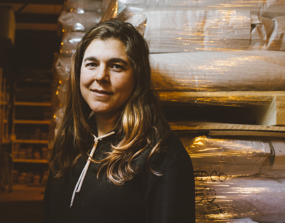 Meg Liebman, a farmer in Unity in the summer months, works in the Moose Tubers section at seed company Fedco in Clinton come winter.