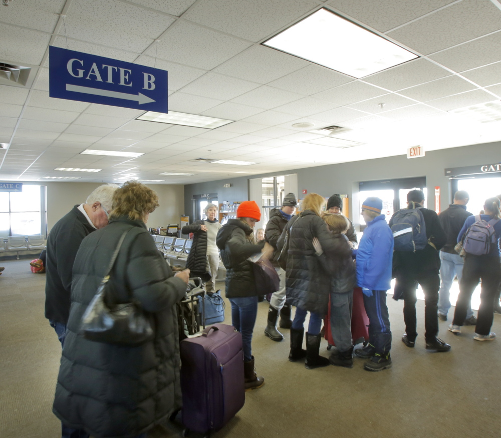 Passengers wait to board a bus at the Portland Transportation Center. The city wants to build a larger transportation center on Thompson’s Point, but finding the money won’t be easy.