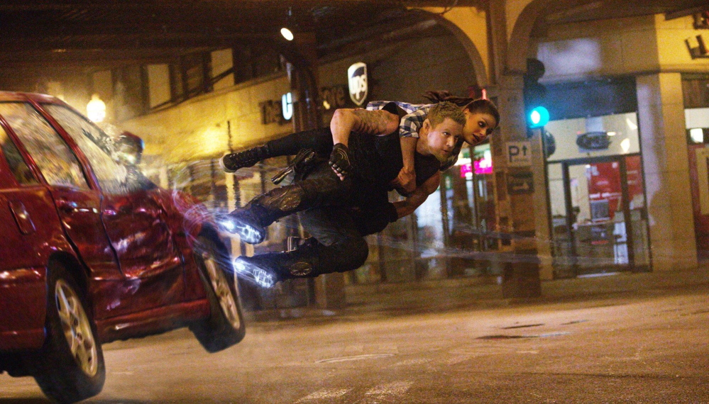 Channing Tatum as Caine and Mila Kunis as Jupiter in “Jupiter Ascending.”