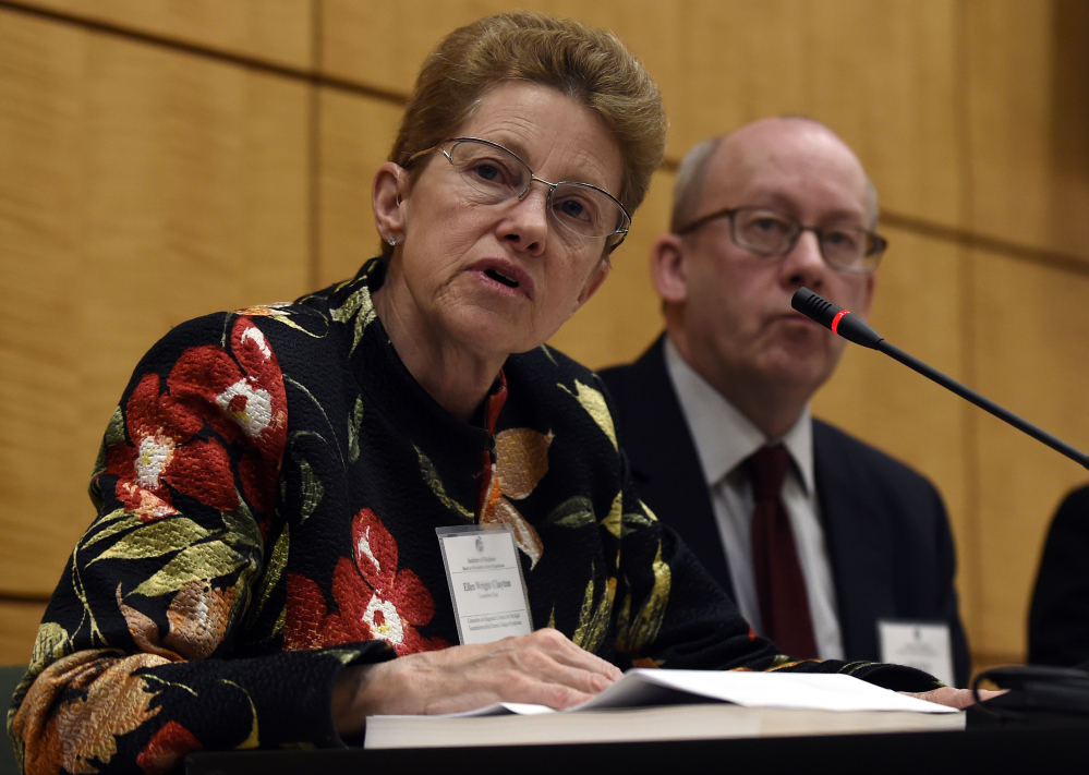 Dr. Ellen Wright Clayton, chair of the Committee on Diagnostic Criteria for Myalgic Encephalomyelitis/Chronic Fatigue Syndrome, left, speaks during an open meeting at the Institute of Medicine in Washington, Tuesday. Chronic fatigue syndrome is a real and serious disease that needs a new name to reflect that – and a straightforward way to diagnose the illness, a government advisory group declares. 
The Associated Press