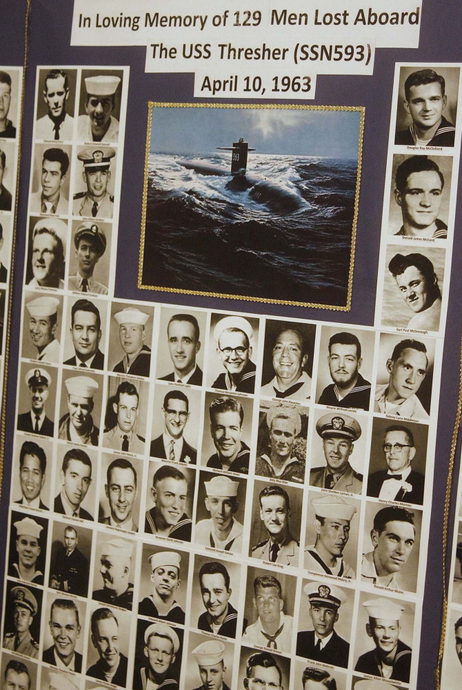 Photos of the 129 crew members lost on the USS Thresher are displayed at a past memorial service. This year’s commemoration takes place Saturday at Traip Academy in Kittery.