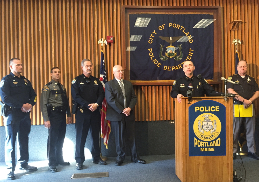 Portland Police Chief Michael Sauschuck, at the podium during a news conference Wednesday, said that a legislative effort to repeal the requirement for a concealed weapons permit would endanger the public. WIth him, from left, are Gorham's interim Police Chief Christopher Sanborn; Scarborough Capt. David Grover; Yarmouth Lt. Dean Perry; and South Portland Chief Ed Googins. At right is Cumberland County Sheriff Kevin Joyce.