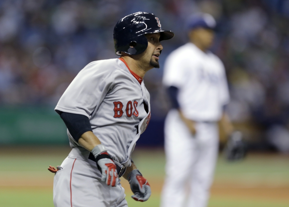 Boston Red Sox's Shane Victorino watches his double off Tampa Bay Rays relief pitcher Jose Dominguez in Tuesday's ninth inning.
The Associated Press