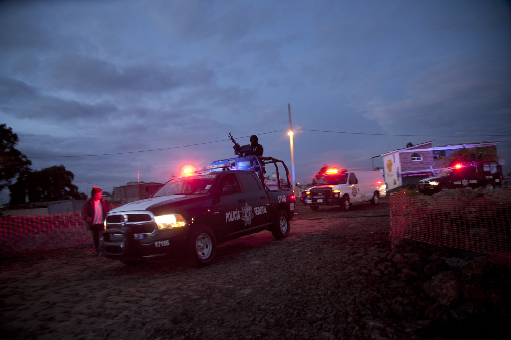 Federal police patrol near the maximum security prison Altiplano in Almoloya, west of Mexico City, early Sunday.