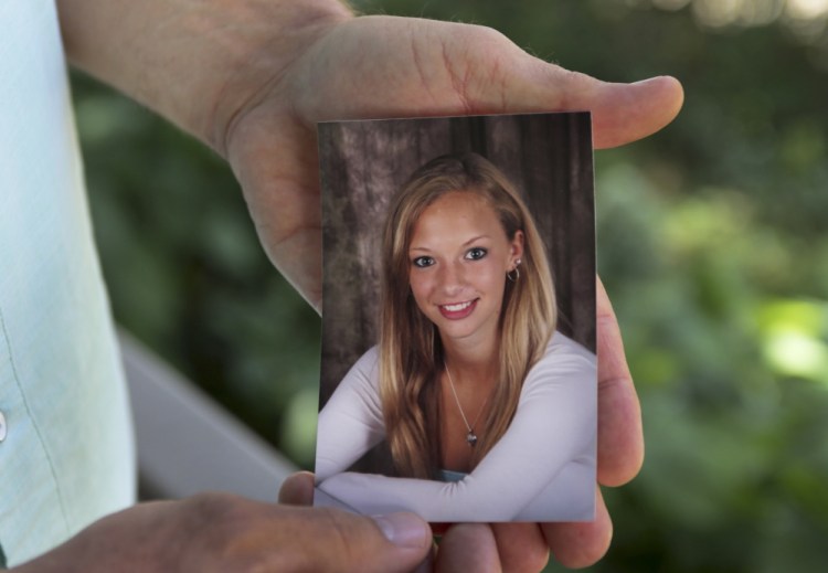 John Zarnoch holds a picture of his daughter Emily Zarnoch of Quincy, Massachusetts, who was killed by a hit-and-run driver in York.