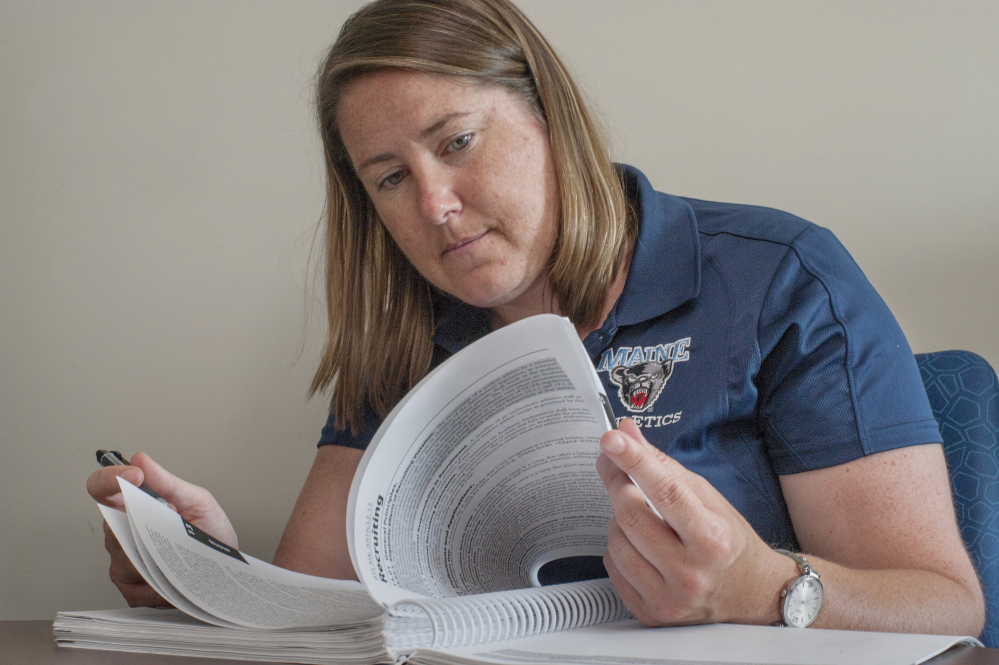 The NCAA rules governing recruitment are so complex that universities all employ one or more “compliance officers.” At UMaine, that’s Eileen Flaherty, pictured here at her office at the Memorial Gym in Orono.