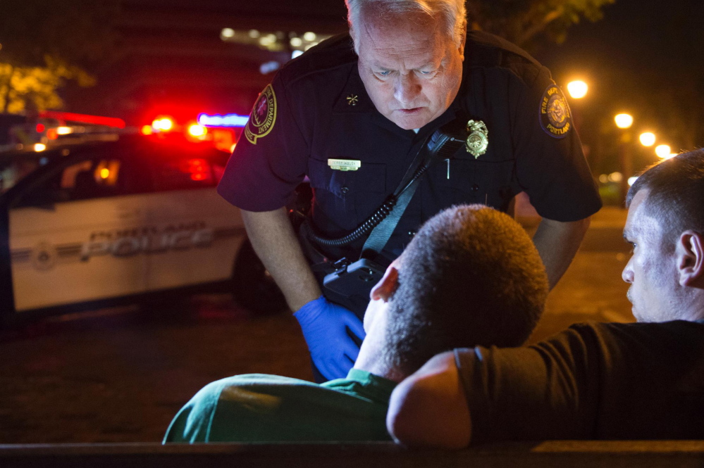 Terry Walsh, deputy fire chief in Portland, responds to a possible heroin overdose by an 18-year-old man on July 4.