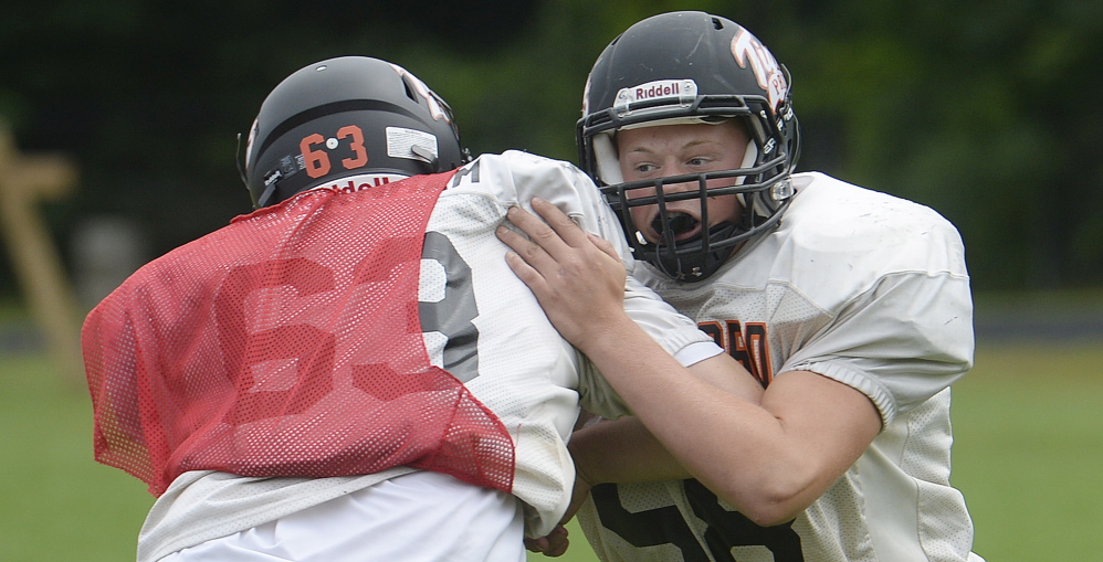 Biddeford senior guard Ben Plante, right, said the Tigers have worked hard in the preseason to get ready for their first season in Class B after a storied history in Class A. Biddeford was once a powerhouse, but has not won