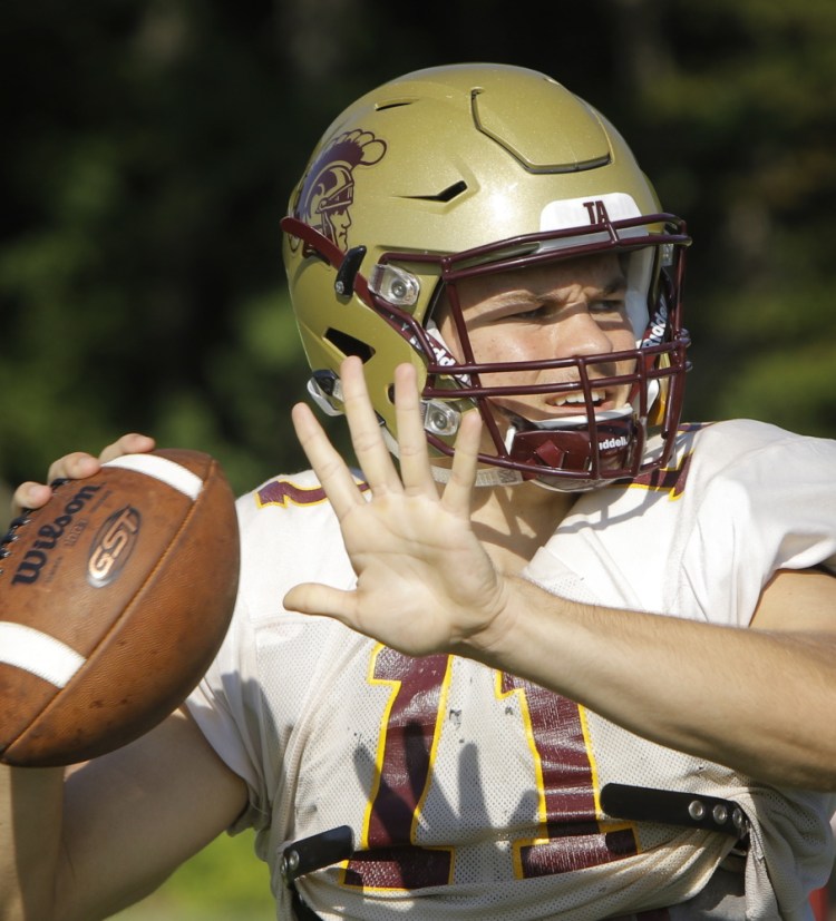 Thornton Academy quarterback Austin McCrum and teammates will use a new helmet designed to absorb impacts better and minimize concussions.