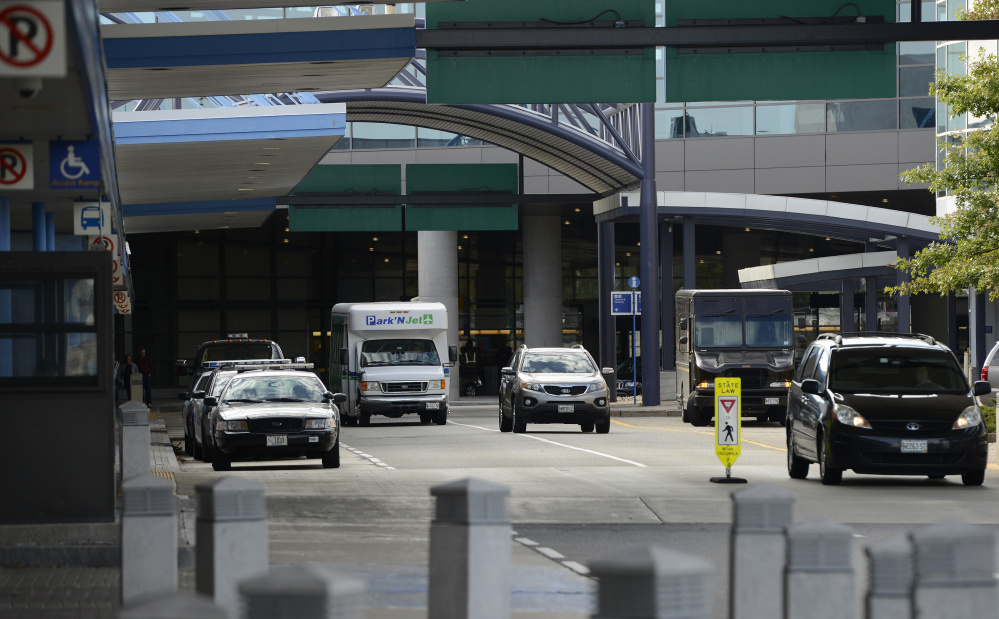 If legislation to let Maine municipalities regulate Uber becomes law, spaces would be designated for Uber drivers outside the Portland jetport, above, so the drivers don’t clog the cellphone lot or pickup areas while awaiting fares.