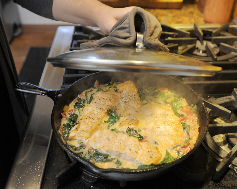 The fish, vegetables and sauce are finished together in one pan.