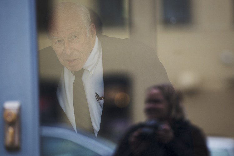 Russell “Rusty” Brace, 82, looks out the door toward reporters before leaving U.S. District Court in Portland on Friday.