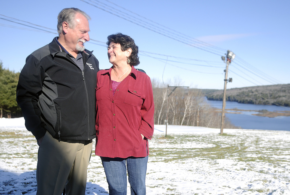 Ted Johnston and Marlene Thibodeau, parents of Marlee Johnston, visit the ski slope at Kents Hill School in Readfield. Their daughter, who was killed 10 years ago, had planned to attend the school. The annual Marlee Johnston Alpine Race is set for Jan. 9. The Marlee Johnston Memorial Golf Tournament and Marlee’s Ride also are held each year.