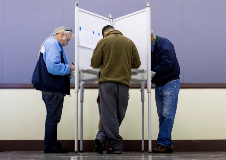 Portland voters fill out ballots Nov. 3 at Merrill Auditorium. The goal of a public finance scheme like Maine’s is to elect representatives who are accountable only to constituents. Leadership PACs undermine that. 2015 Press Herald File Photo/Ben McCanna