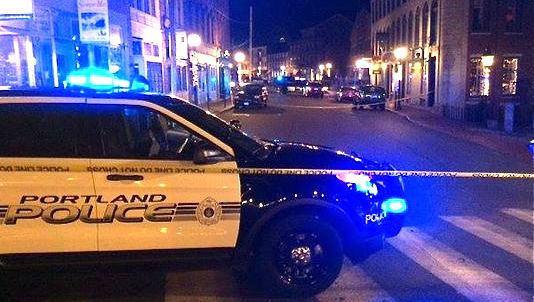 Police blocked off a section of Fore Street early Monday morning while they investigated a shooting that injured two men. WCSH photo