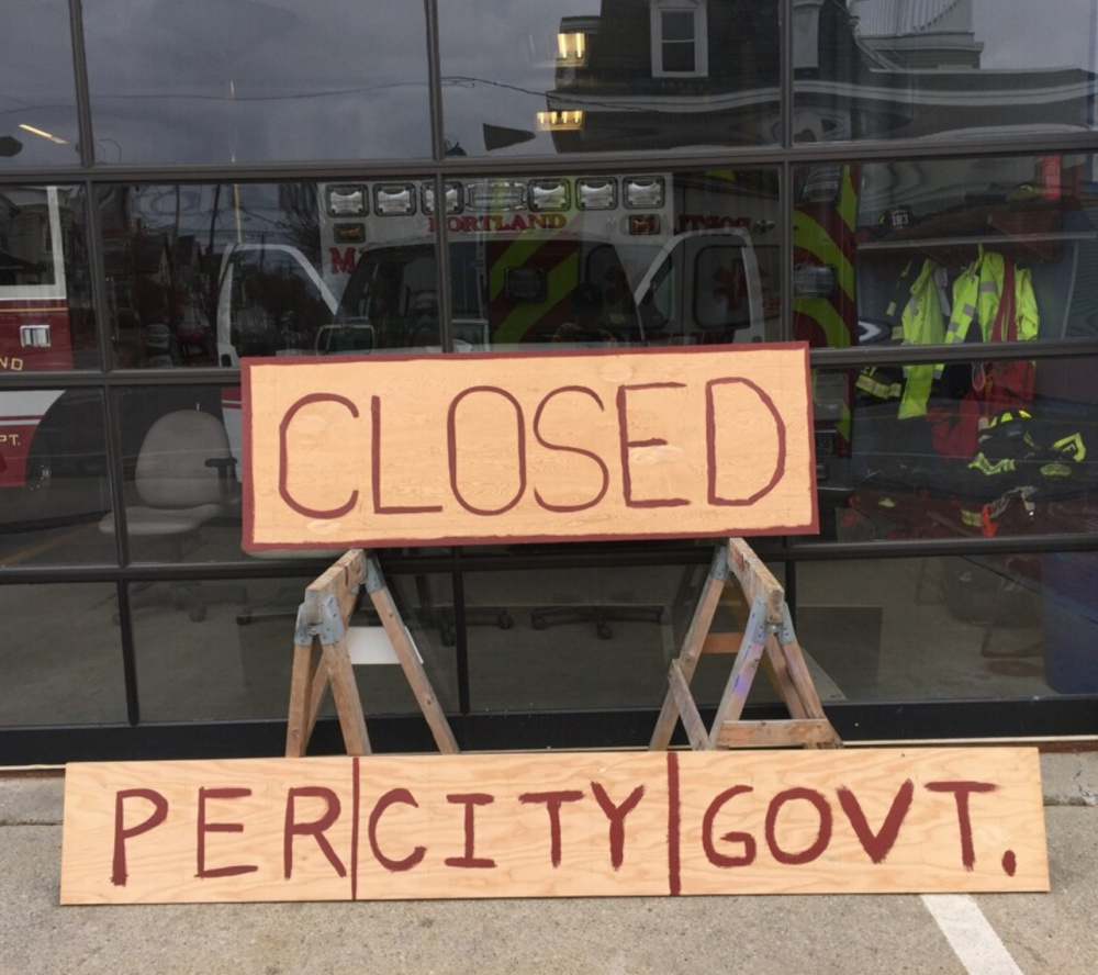 Contrary to the sign, the Munjoy Hill fire station has not been closed; its ambulance is sometimes taken out of service.