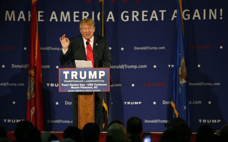 Republican presidential candidate Donald Trump speaks during a rally Monday, Pearl Harbor Day, aboard the aircraft carrier USS Yorktown in Mt. Pleasant, S.C. While other Republican politicians condemned Trump’s proposal Monday to keep all Muslims from entering the U.S., people at the rally cheered and shouted in support.