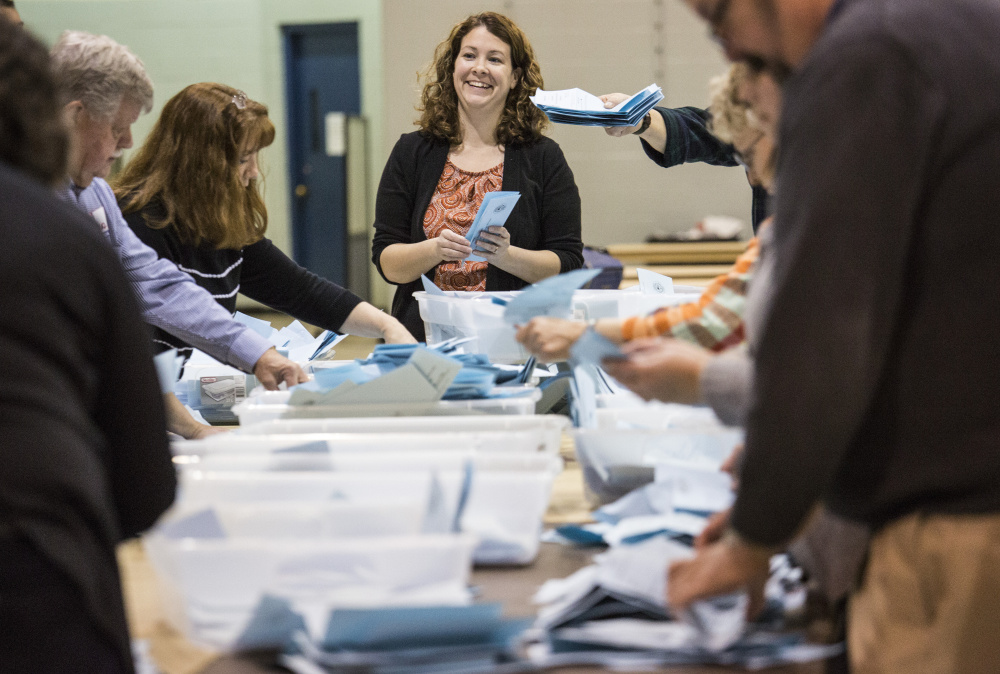 Votes are counted for Ben Chin and Robert Macdonald after the polls closed in Lewiston on Tuesday night.
Whitney Hayward/Staff Photographer