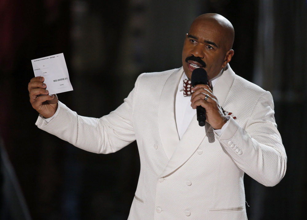 Steve Harvey holds up the card showing the winners after he incorrectly announced Miss Colombia Ariadna Gutierrez at the winner at the Miss Universe pageant Sunday in Las Vegas.