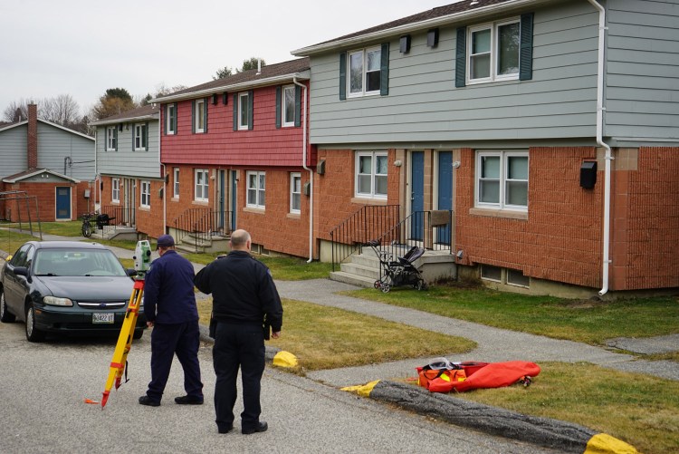 Police conduct an accident investigation Monday in the parking lot at Hillview Apartments in Lewiston, where a father backed up his vehicle and accidentally struck his 2-year-old son.