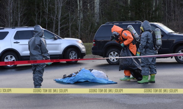 Members of the Maine Drug Enforcement Agency sift through evidence believed to be  part of a methamphetamine lab.  The agents seized the evidence at a home on Old Thompson Road and transported it to Buxton's public works facililty to give it a thorough examination..
Shawn Patrick Ouellette ? Staff Photographer
