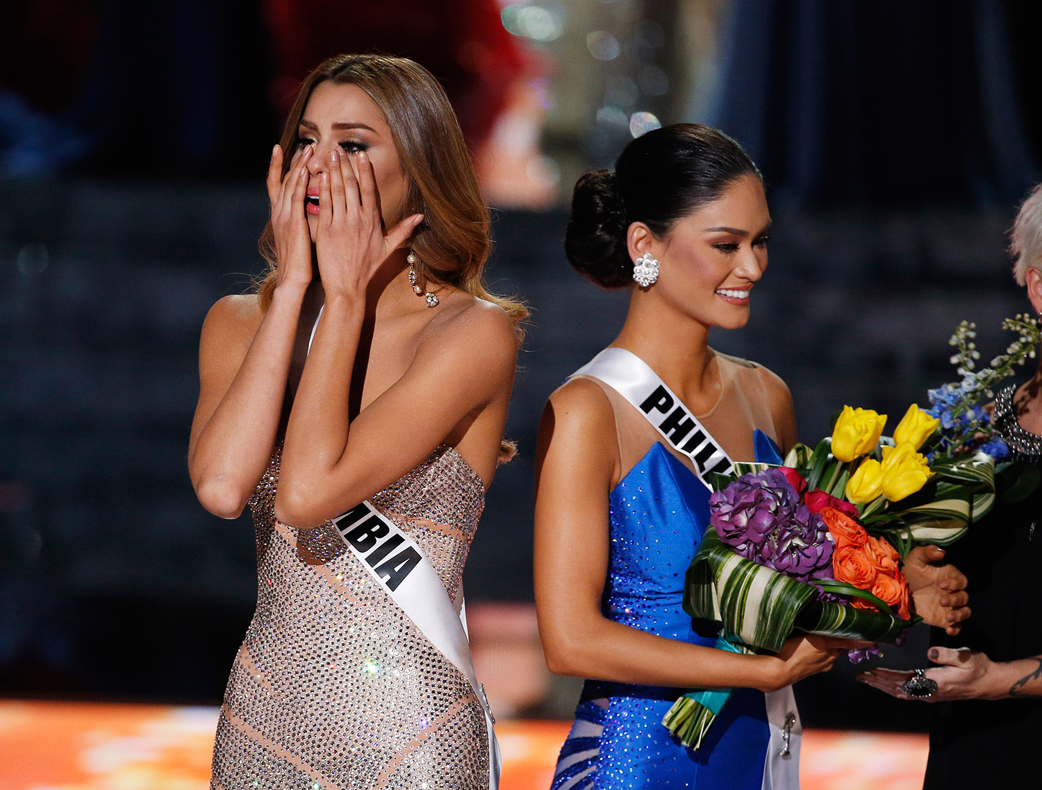 Miss Colombia Ariadna Gutierrez, left, reacts after she was named Miss Universe while standing with Miss Philippines Pia Alonzo Wurtzbach at the Miss Universe pageant Sunday in Las Vegas. Gutierrez was incorrectly crowned before Wurtzbach was named Miss Universe.